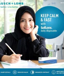 A woman sitting at a desk writing wearing Bausch & Lomb SofLens Daily Lenses